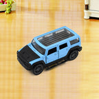 Overhead view of several mini pull back car toys in varied designs.