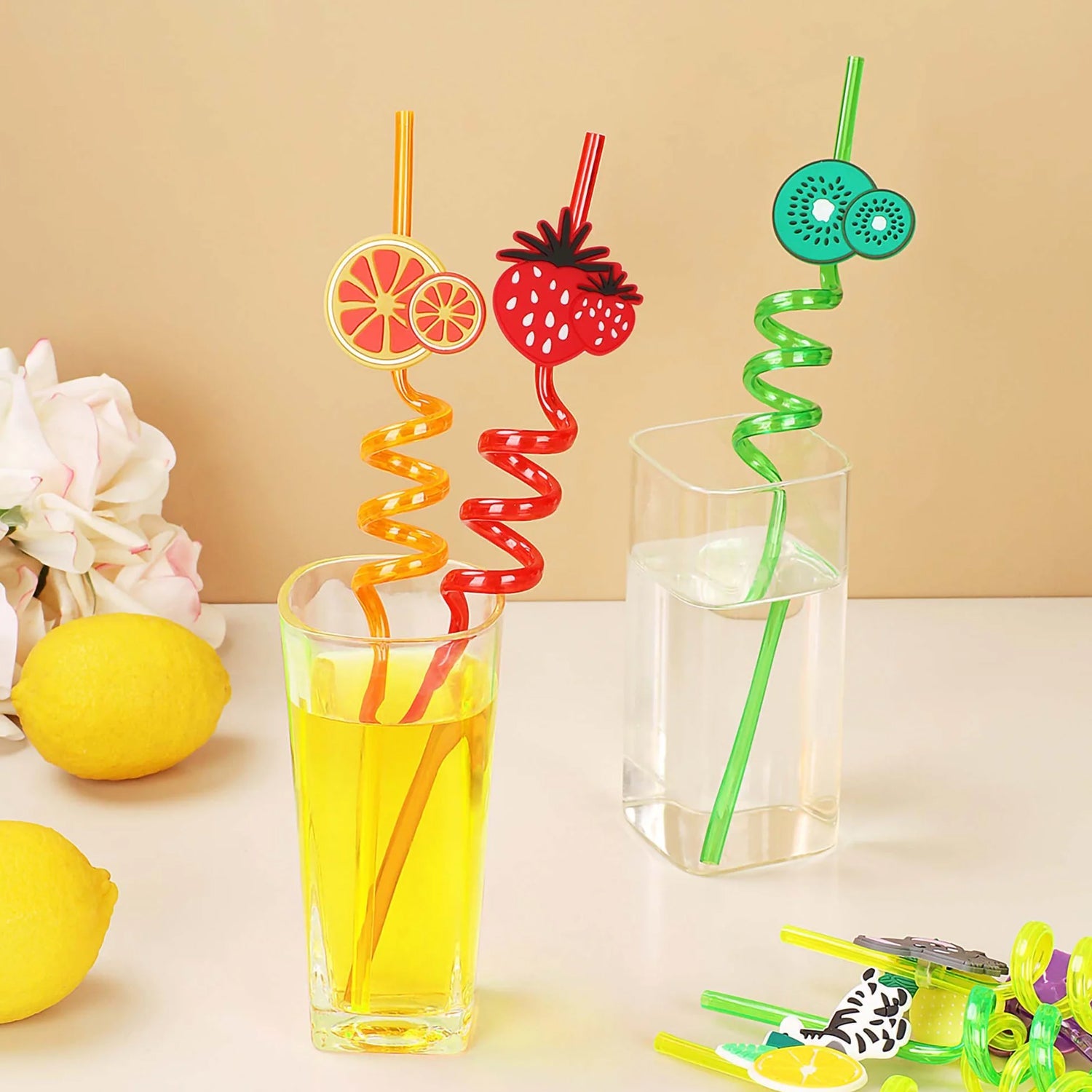Bundle of multi-coloured reusable plastic straws with playful truck toppers.