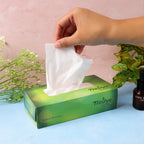 Close-up of embossed texture on a single Freshee skin-friendly facial tissue sheet
