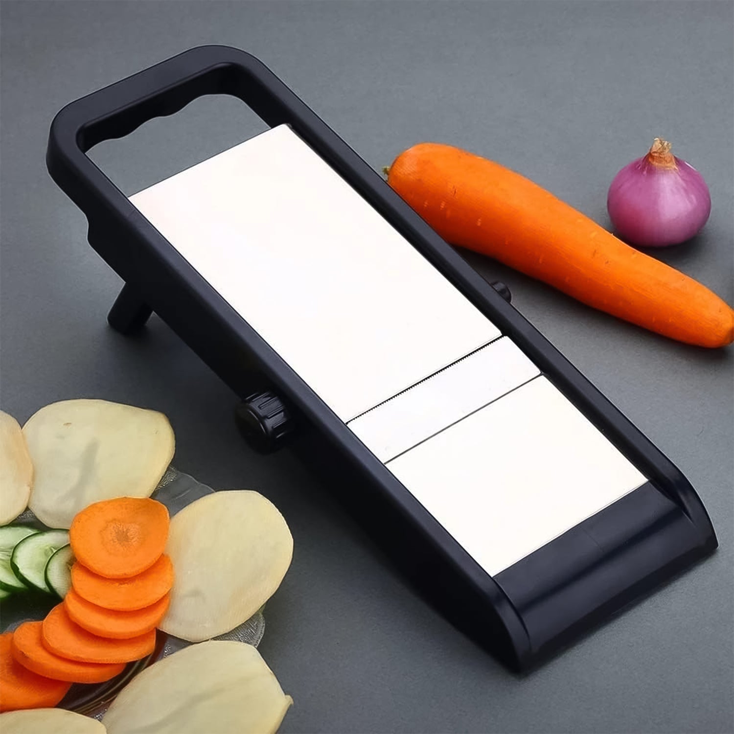 Close-up of the comfortable plastic handle and blade adjustment knob on the slicer.