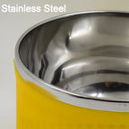 The insulated Maggie Bowl with Lid displayed with a spoon, ready for a warm meal.