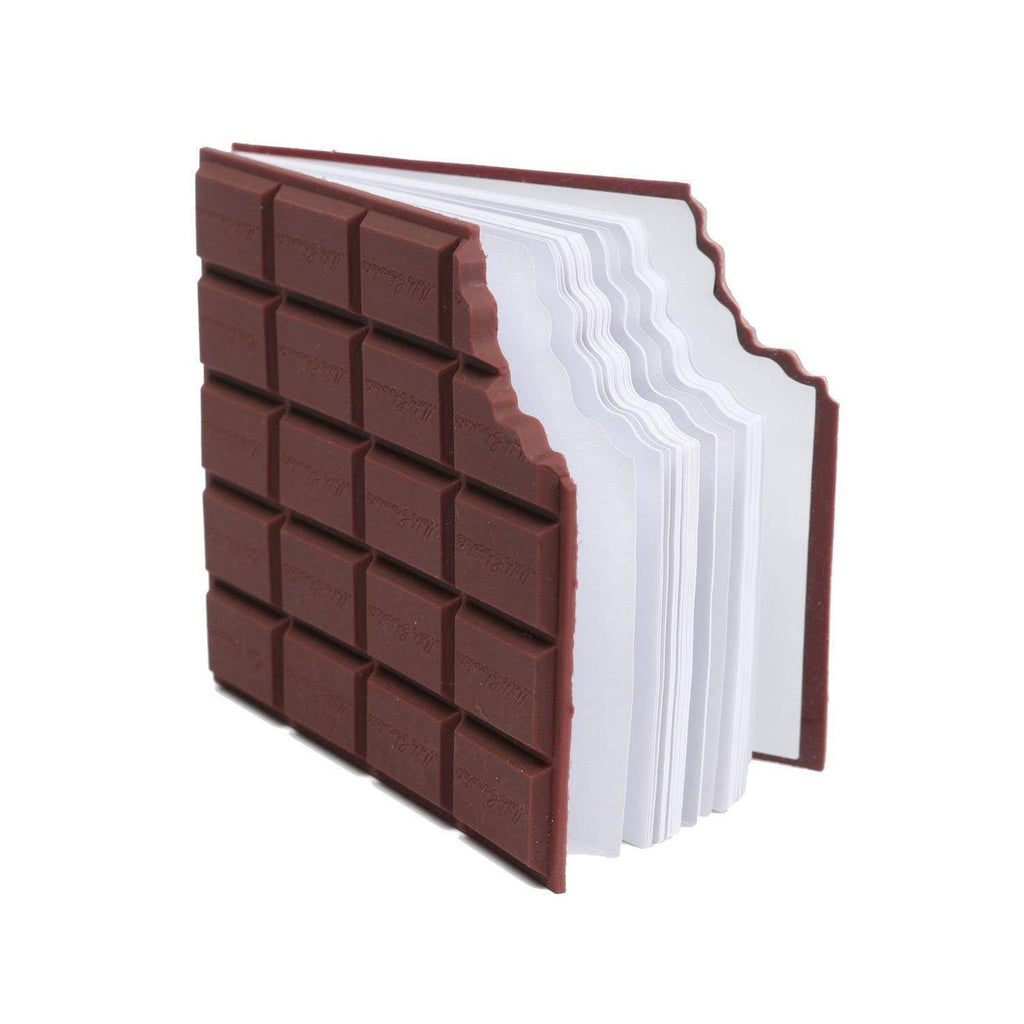 Chocolate scented diary with a pen on a wooden desk, ready for use.