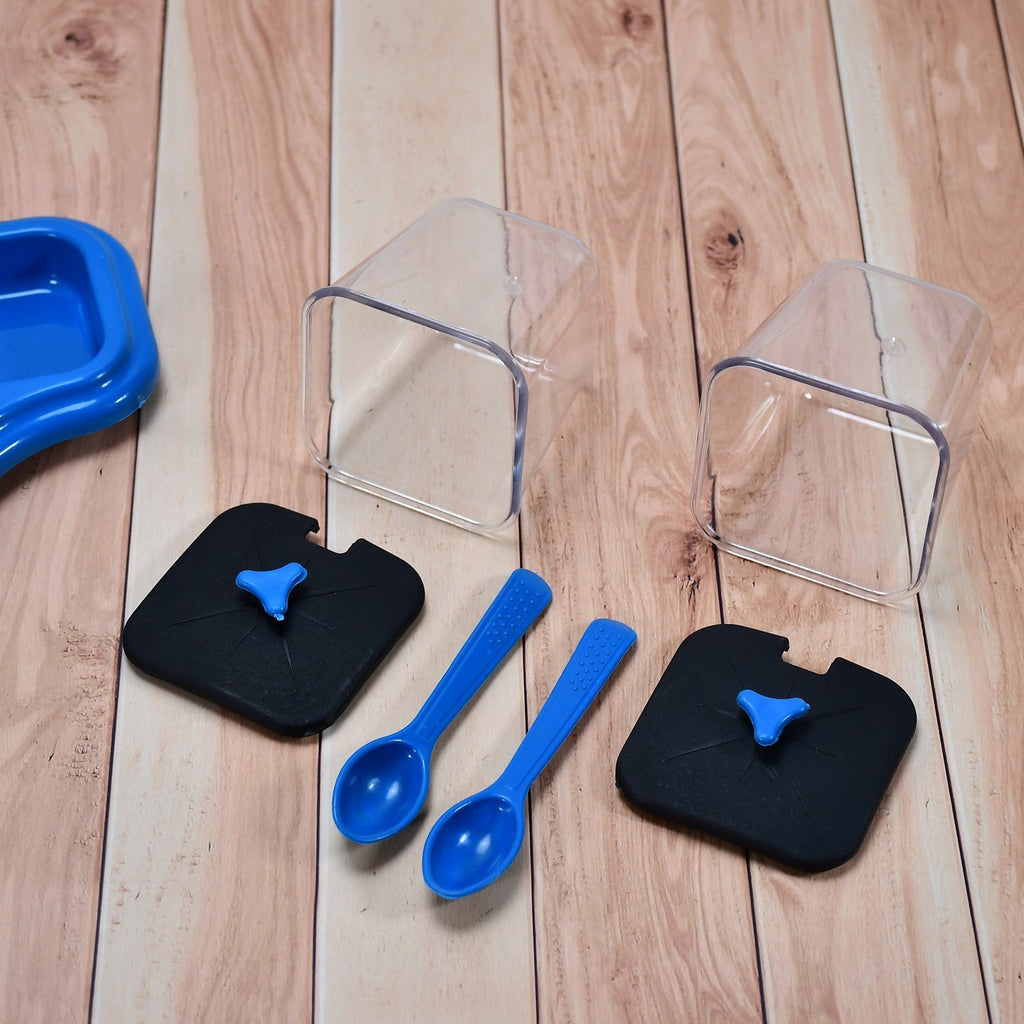 The complete Tidy Table dining table stand set, featuring two jars, a tray, and spoons.
