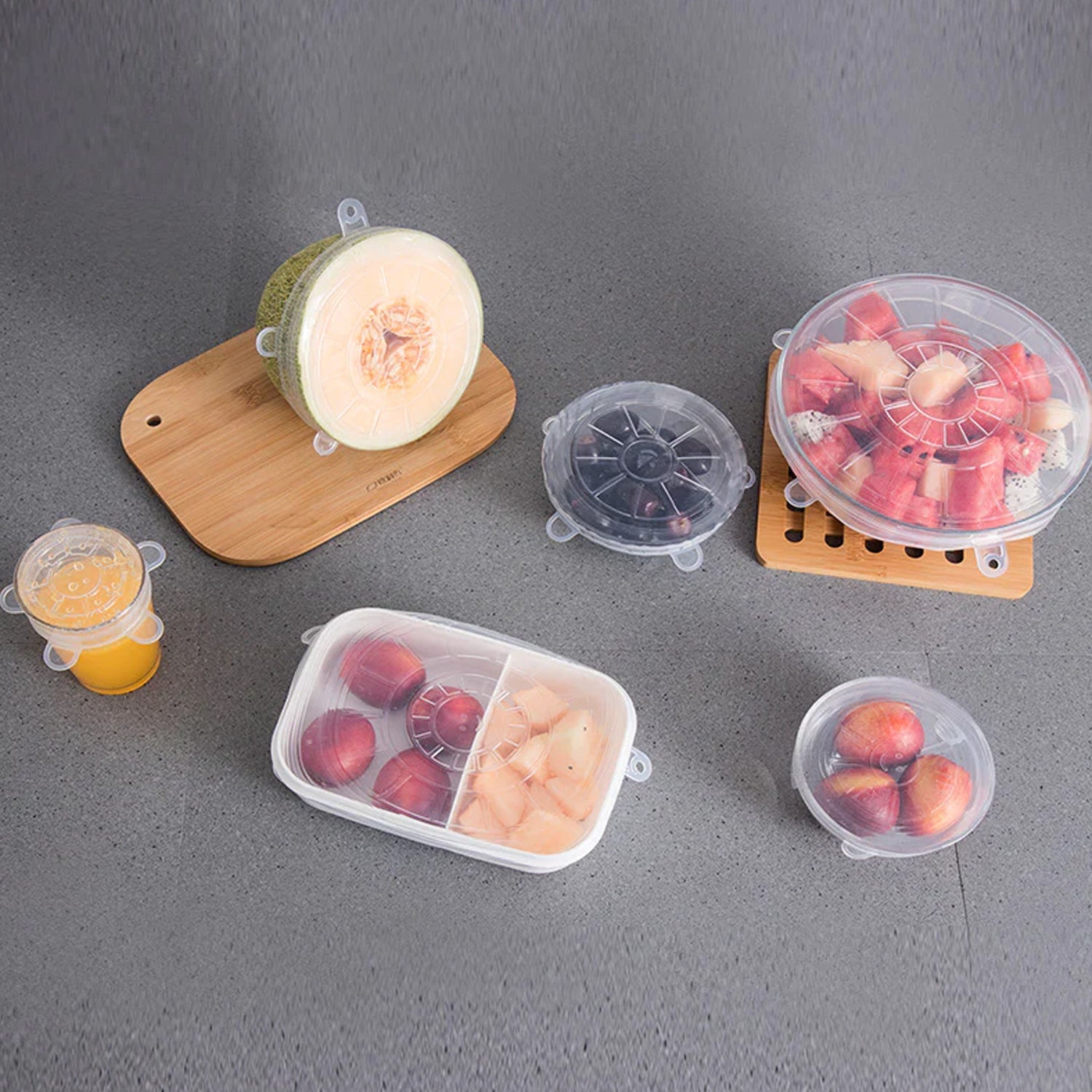 Flexible silicone covers fitted on various kitchen containers