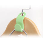 Close-up view showing smooth finish of plastic hanger hooks