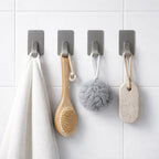 Close-up showing adhesive backing of wall hooks