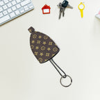 Compact keyholder with attached strap for easy carrying and hanging