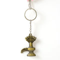 Close-up of Lord Shiva Shivaling metal keychain with detailed serpent design