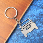 Side view of metal jeep keychain showing compact design