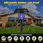 Solar mosquito zapper garden light installed along pathway
