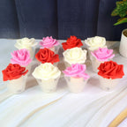 Flameless LED candle with realistic rose flower and glass holder on table