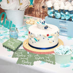 Mint green disposable paper napkins with decorative scalloped edges for baby shower