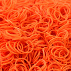 Orange elastic rubber bands closeup showing texture