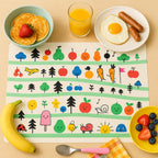 Kids placemat featuring bright cartoon design and fruits