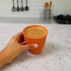 Transparent plastic small drinking glass showing smooth rim and body