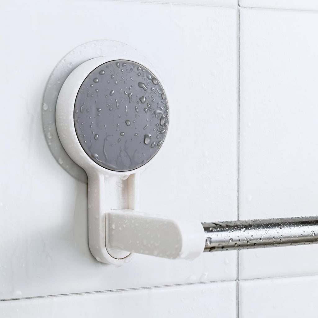 Self-adhesive towel rod mounted on a white clean wall