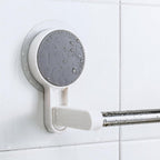 Self-adhesive towel rod mounted on a white clean wall