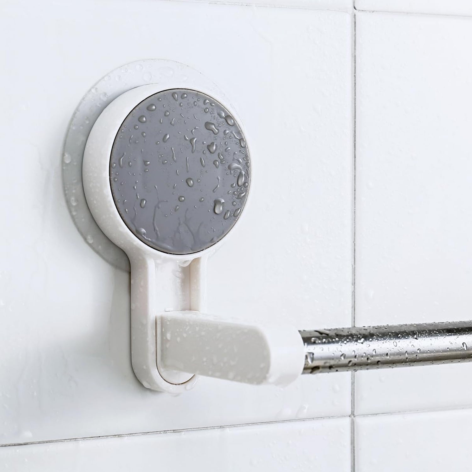 Self-adhesive towel rod mounted on a white clean wall