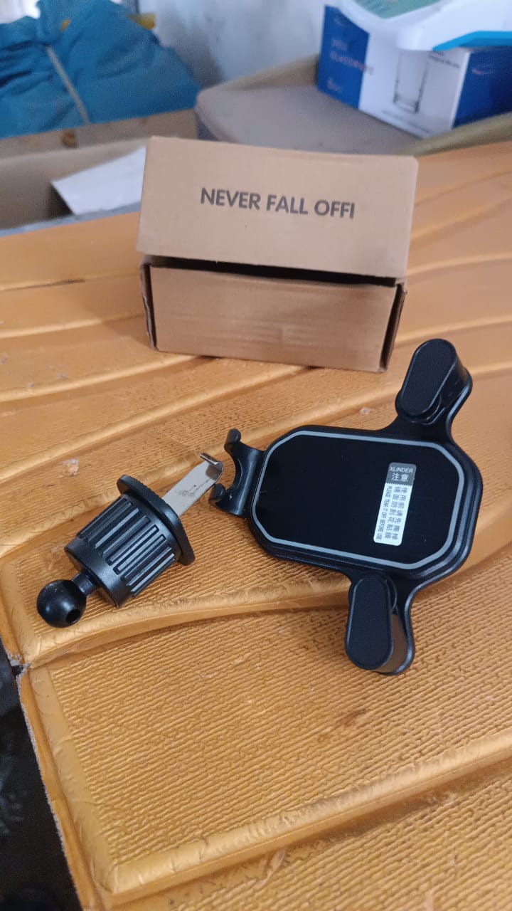 Driver's perspective showing gravity phone holder mounted on dashboard air vent