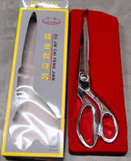 Top-down view of Cisora's gold-plated cloth cutting scissors, highlighting precision.