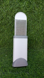 Close-up of the double-sided lint remover brush texture on fabric.