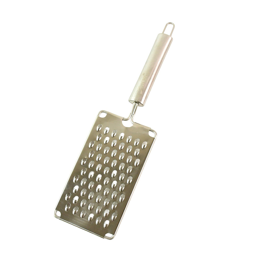 Shiny stainless steel surface reflecting light on vegetable grater