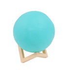 The Moon Night Lamp's durable plastic stand provides stable support for the spherical light.