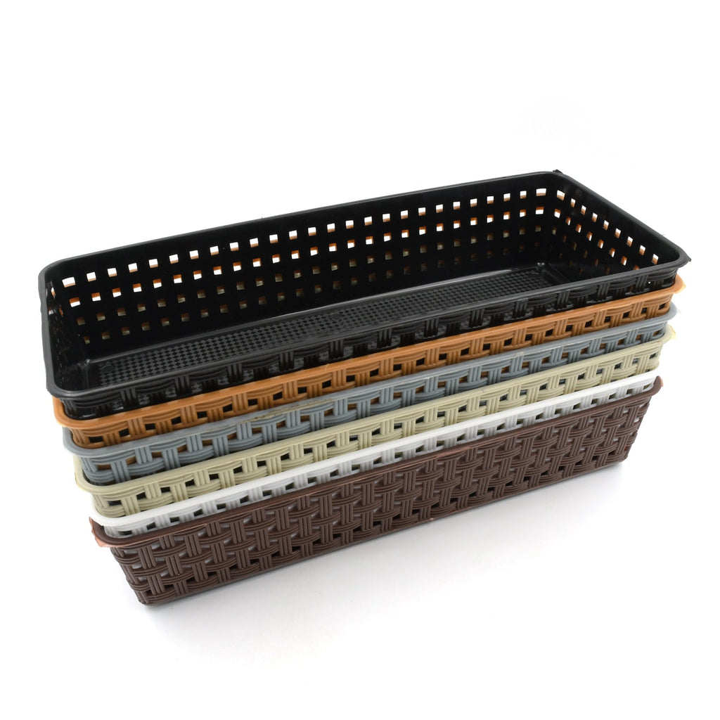 Plastic storage bins used as kitchen drawer dividers for cutlery and utensils.