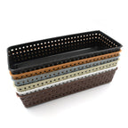 Plastic storage bins used as kitchen drawer dividers for cutlery and utensils.