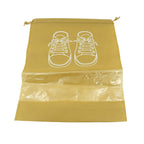 Compact folded waterproof shoe bag next to a pair of shoes, highlighting its portability.