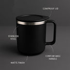 Close-up of the black insulated coffee mug, highlighting its sleek matte finish.