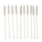 Nylon bristles cleaning a reusable metal straw with the brush from the set