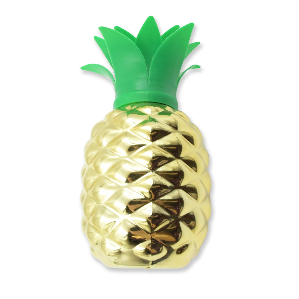 Pineapple cup with straw as part of a festive tropical party table setting.