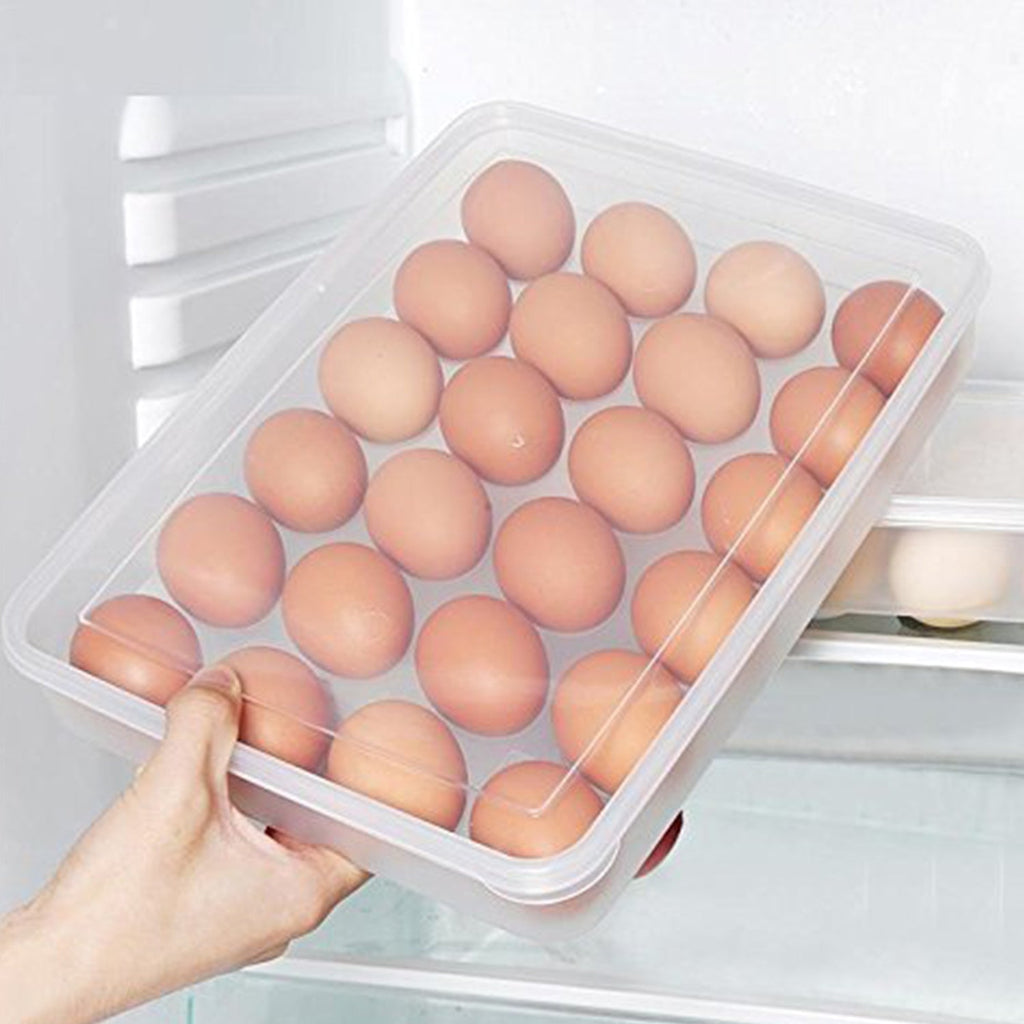 Hand pulling out a clear 24-grid plastic egg container from fridge shelf