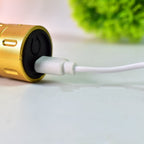 The men's electric hair trimmer charging via its dedicated power adapter.