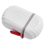 VelvetBubbles travel soap case next to a ruler, showing its compact size for travel.