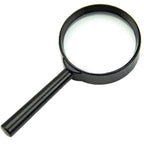 Portable 50mm magnifying glass for reading small print in a newspaper.