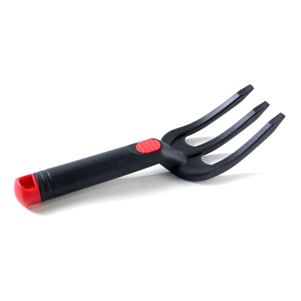 Close-up of garden hand cultivator, a manual soil loosening tool