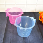 Stack of transparent plastic bath mugs, demonstrating their space-saving design.