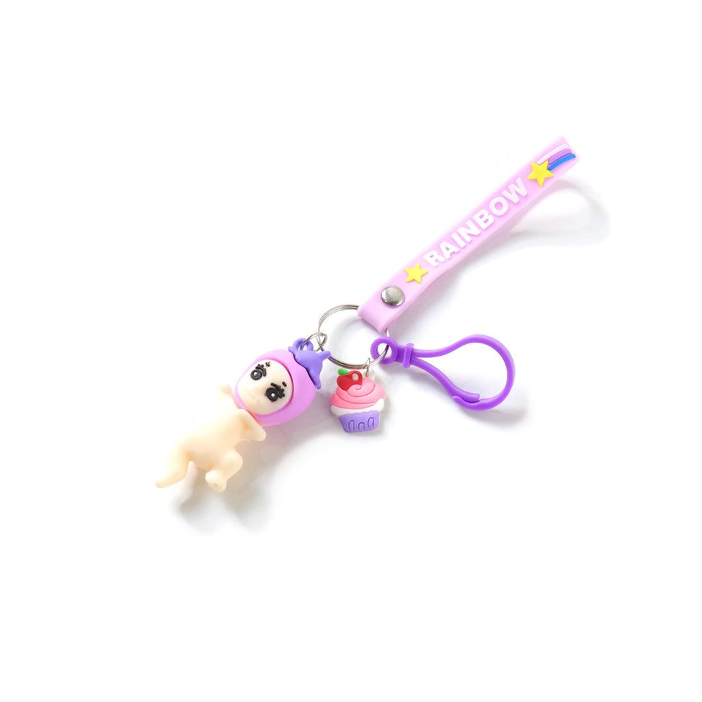 Character keychain featuring doll and cupcake attached to bag zipper