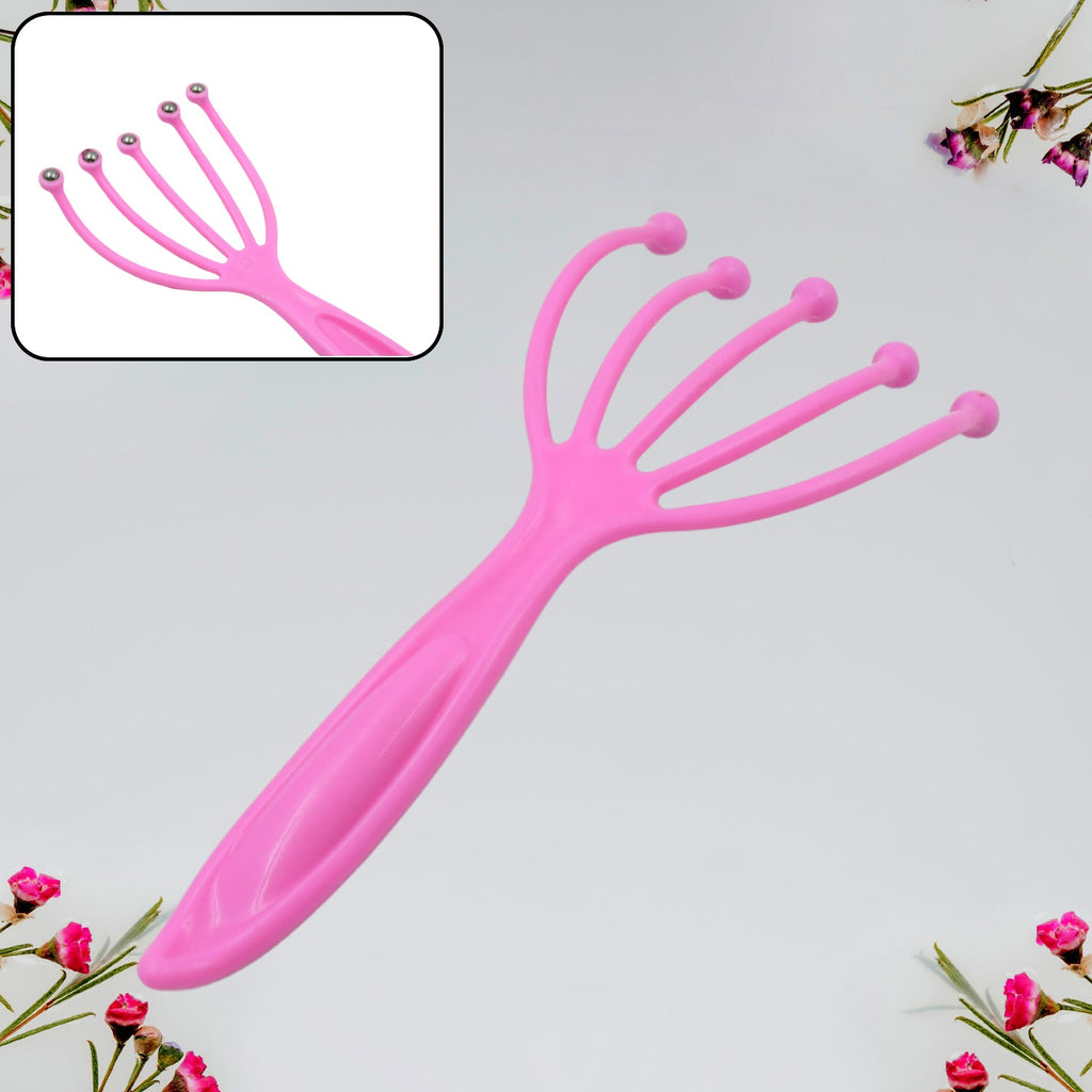 The portable scalp massager placed beside a soft pillow, ready for a relaxing session.