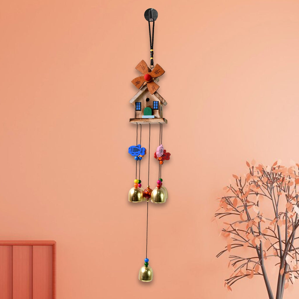 Vivid dragonfly wind chime hanging outdoors catching sunlight
