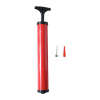 A hand firmly gripping the lightweight plastic ball pump, ready for use.