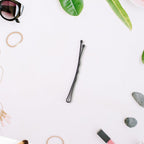 Close-up view of hair styling bobby pins with ball-tipped ends for comfort
