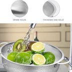 Ergonomic handle detail on the durable stainless steel vegetable colander.