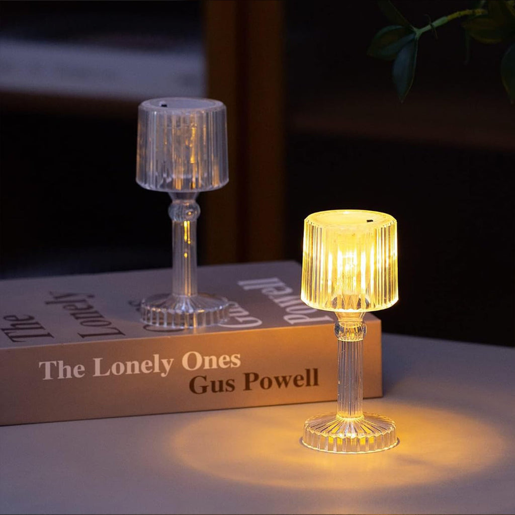 Elegant crystal LED desk lamp placed on a wooden table in a home setting.