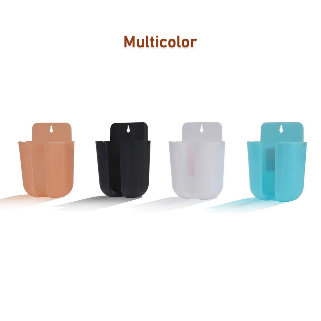 Wall organizer box holding a remote control and a mobile phone.