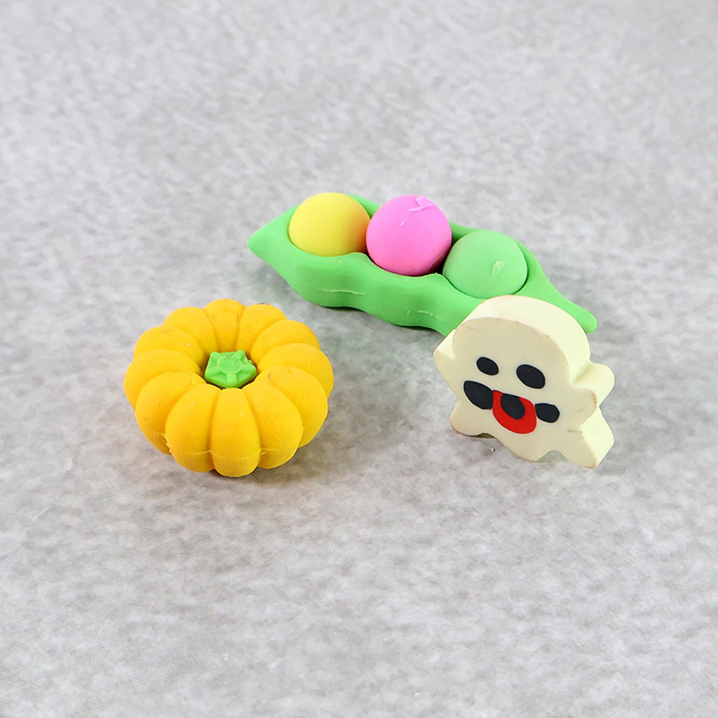 A green pea pod shaped cartoon eraser, designed for a comfortable grip and effective erasing.