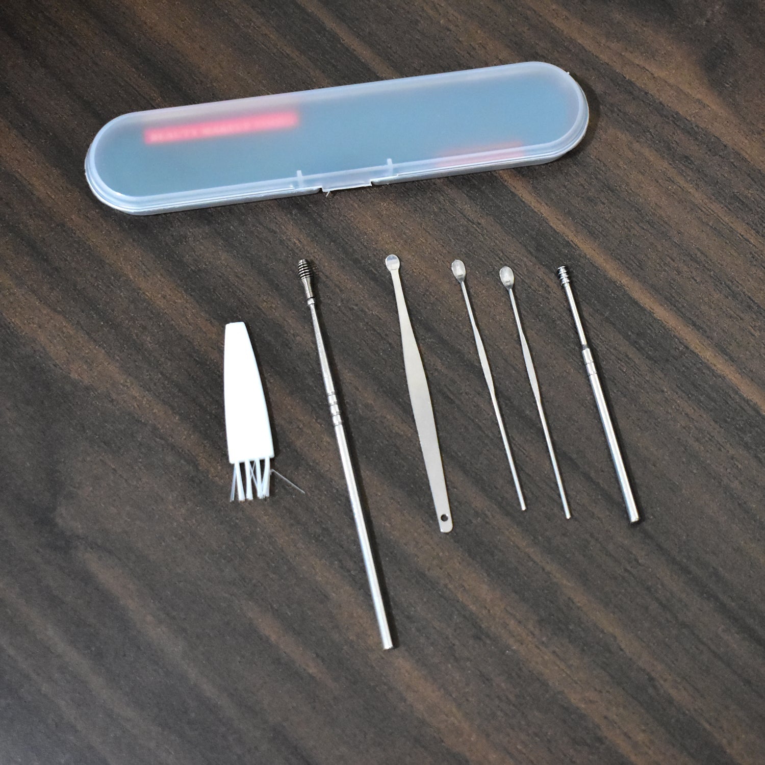 Complete 6-piece Earwax Removal Kit with stainless steel tools and a sleek portable case.
