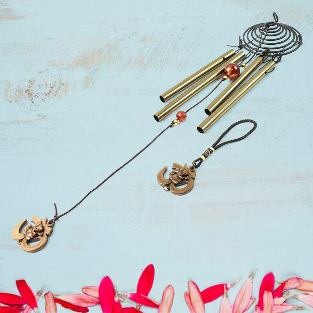 Vivid dragonfly wind chimes hanging outdoors in sunlight